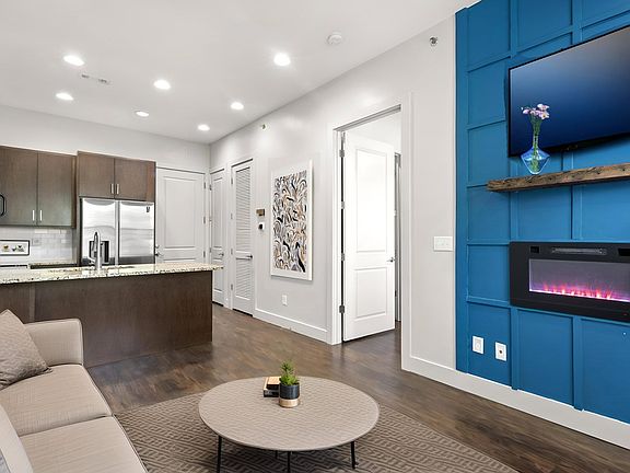 State Street Flats Apartments Living Room with Electric Fireplace