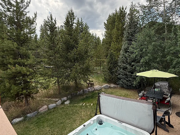 primary bedroom view of hot tub