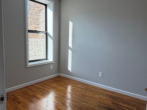 bedroom with large windows and ample closet space.