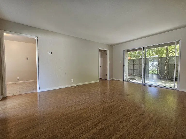 Spacious living and dining room area overlooking patio