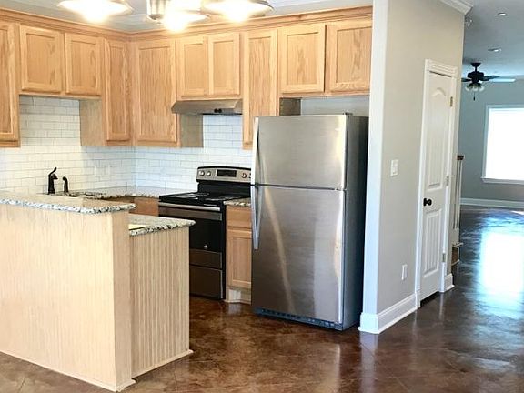 Kitchen between 2 living areas