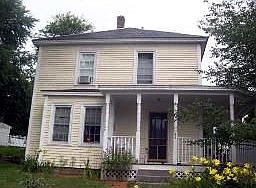 Front view with beautiful gardens