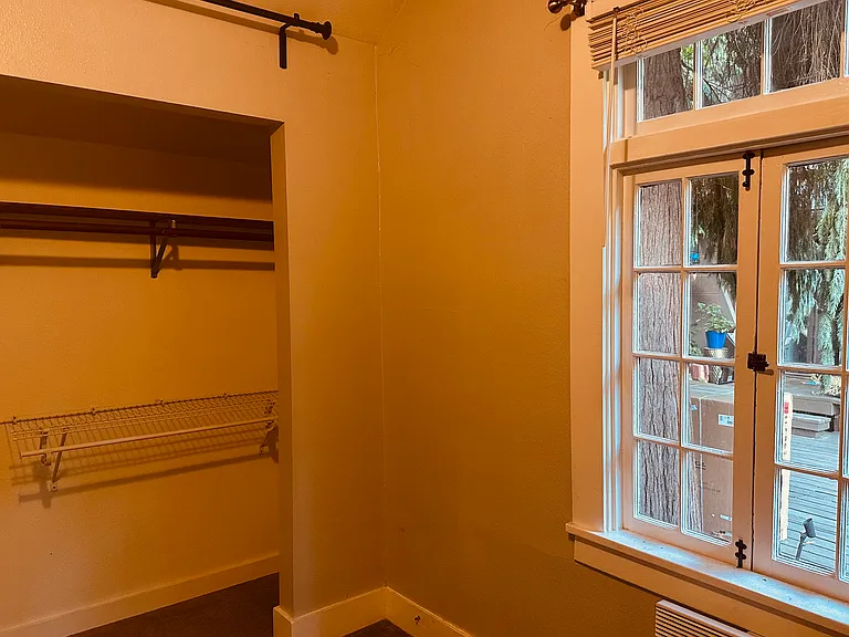 bedroom with large closet comes with full length curtains