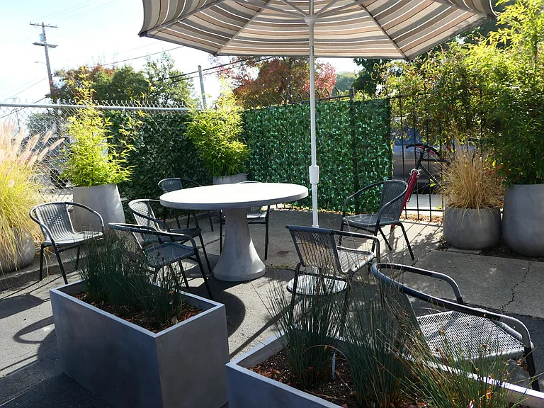 One of two shared patios