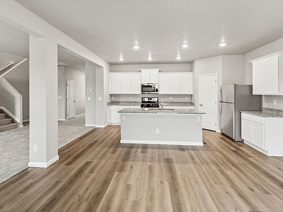 The kitchen overlooks the dining area, ensuring you don t miss a beat while making dinner.