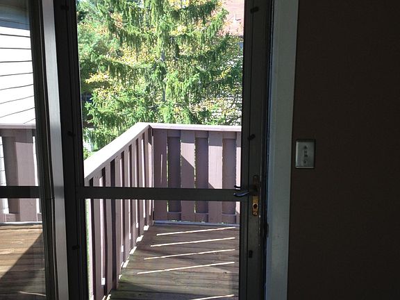 Balcony entrance with storm door