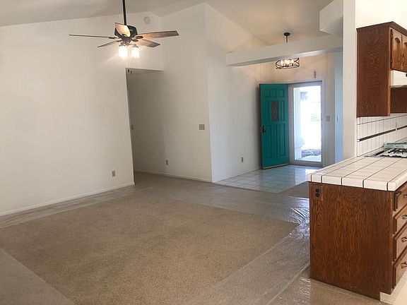 New ceiling fan, entry light and cheerful turquoise colored door. Also high-end front screen door can be left open on balmy nights.