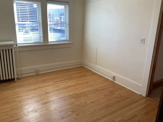 Bedroom with hardwood floors and a northerly exposure.