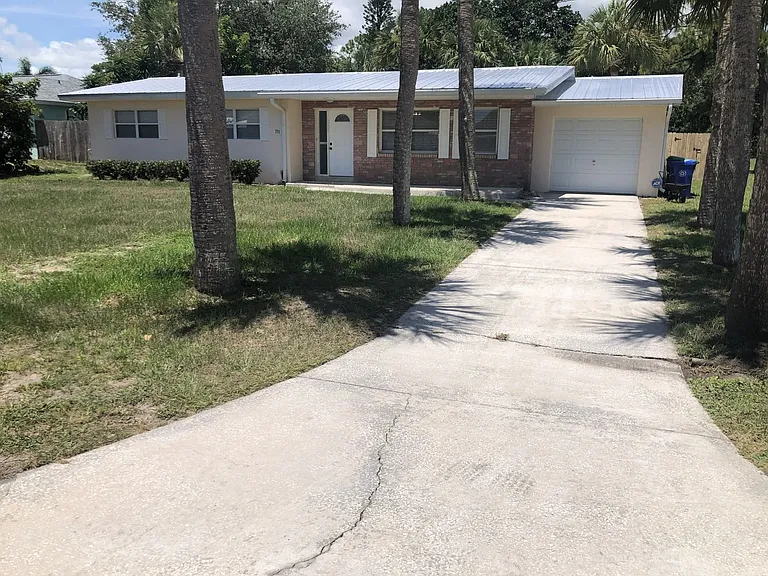 Front of house, driveway, garage