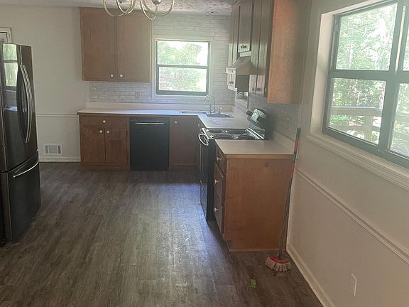 Open-concept Kitchen/Dining with Front Room; includes
dishwasher, and large refrigerator.