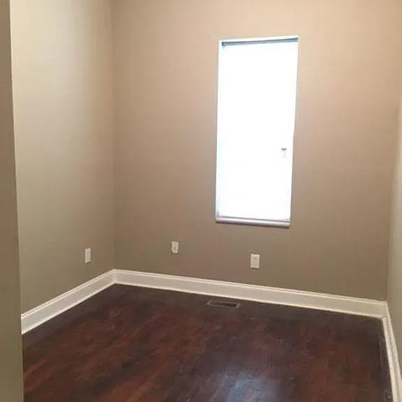 Bedroom 2 with closet and hardwood floors