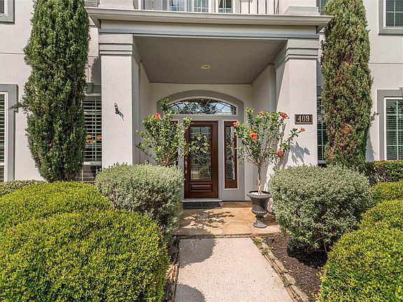 Enter onto the front porch with stone work that accent the solid wood door with beveled glass. Transom completes the elegant app
