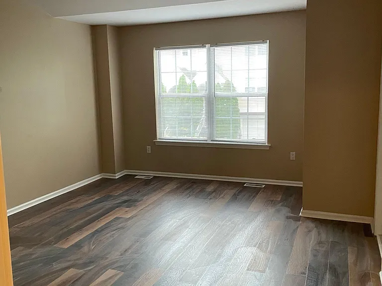 Spacious master bedroom with attached bathroom.