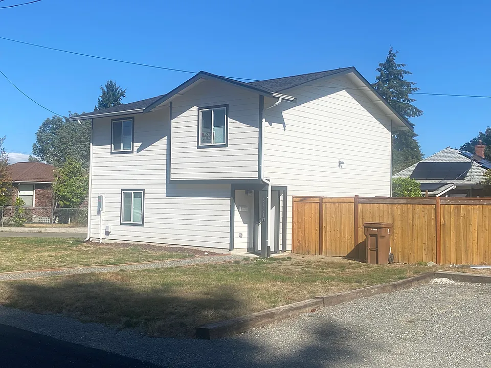 This three bedroom/2 bath home is new condition and has a fenced yard and large one car garage with alley access. Faces south.