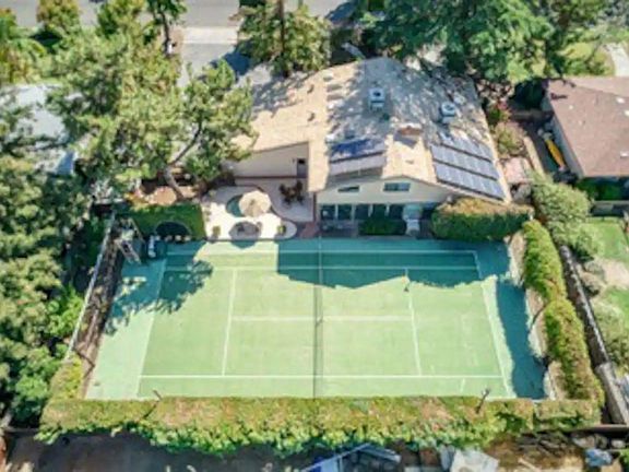 Fun tennis or pickleball court with rackets and balls supplied.
