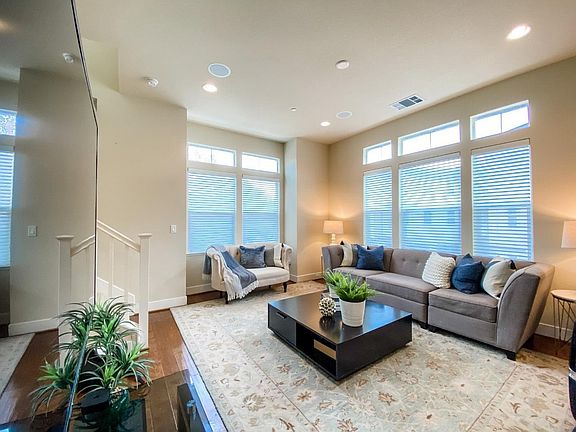 The open-concept main floor with high ceilings and abundant natural light
