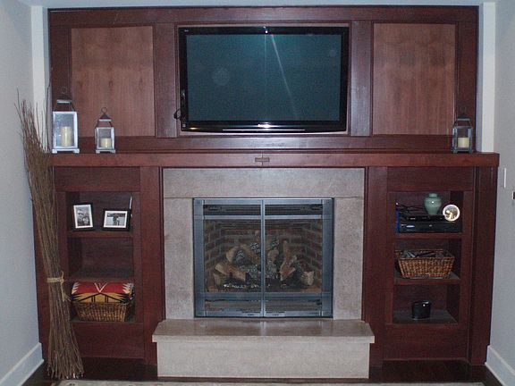 Concrete fireplaced surround with stained Maple from site cut trees.