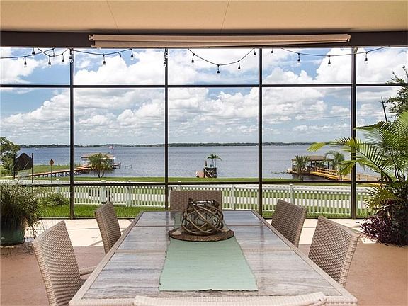 VIEW FROM UNDER LANAI OUT TO THE DOCK AND LAKE