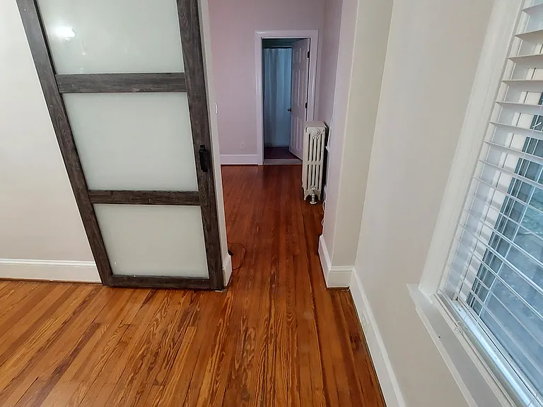 HALLWAY TO BEDROOM AND KITCHEN
