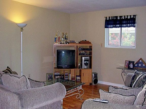 Living room with new windows & fresh paint.