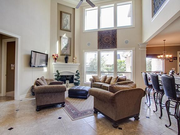 soaring ceilings and floor to ceiling windows allow natural