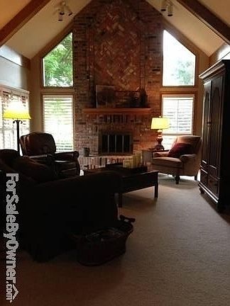 Great Room : Vaulted ceiling, plantation shutters, fireplace