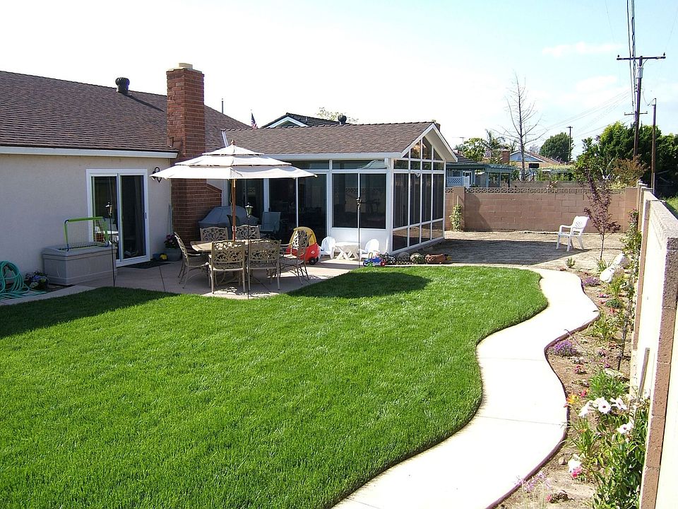 Rear yard, New Sunroom, New patio & grass - 2005