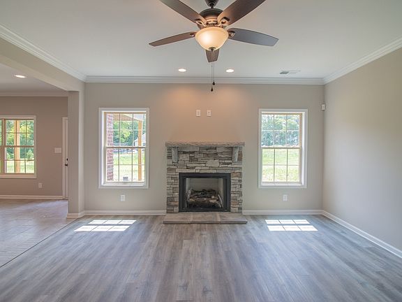 Large, open-concept living room with gas fireplace.