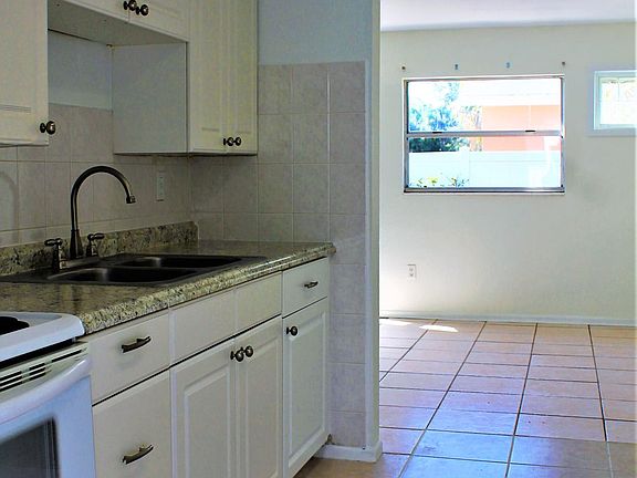 Newer appliances in spacious kitchen.