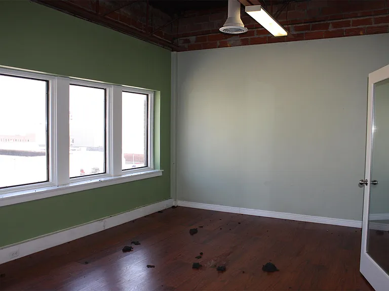 Large manager's office with views of downtown overlooking Mesquite Street.