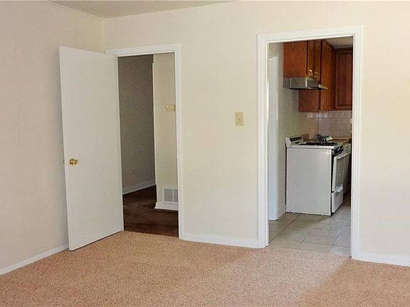 From living room to either kitchen or bedroom hallway