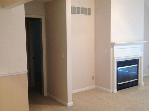 View of living area and entrance to 1st floor bedroom/bathroom.