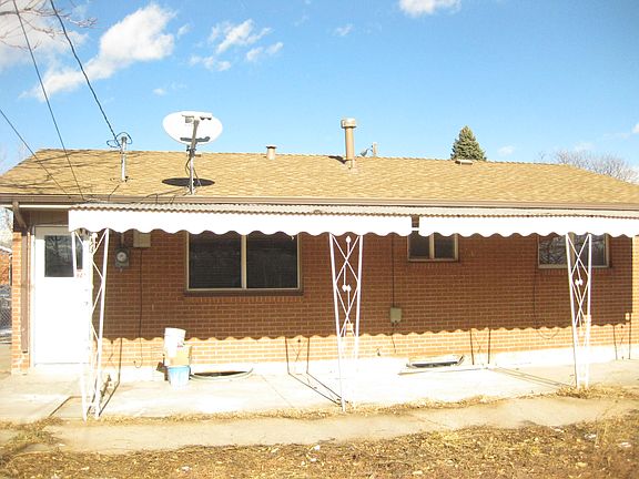 Fenced backyard with covered patio. Great for relaxing.