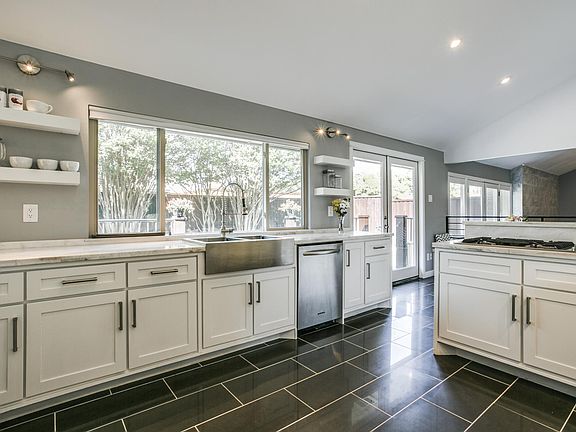 Modern & updated kitchen , lots of light , breakfast nook, walk out to deck , pantry