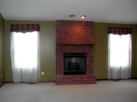 Great room with windows overlooking back yard