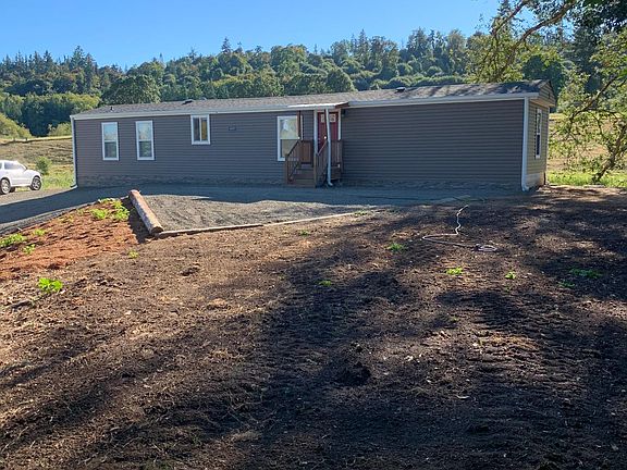 front of house including the yard that has been planted with grass