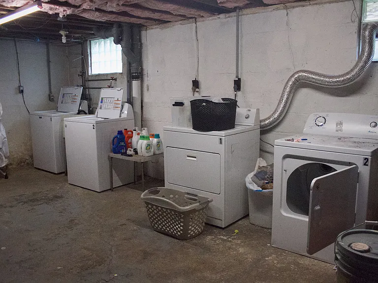 Basement laundry with provided washer/dryer for each unit.