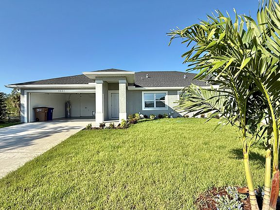 Front view with two car garage