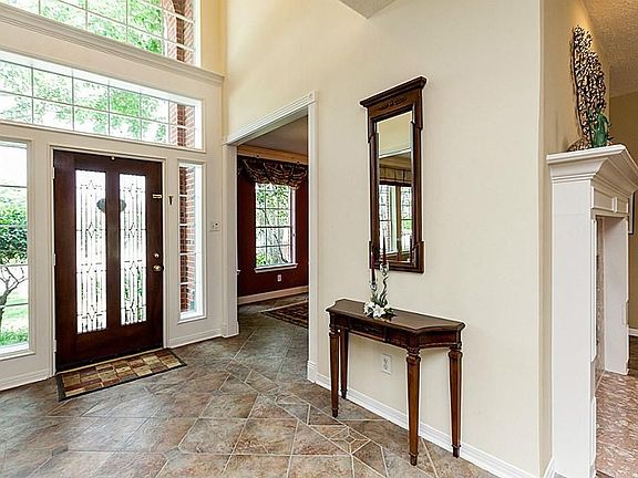 TWO STORY ENTRY WITH EXTENSIVE TILE FLOORING ~ NOTICE THE CUSTOM FEATURES