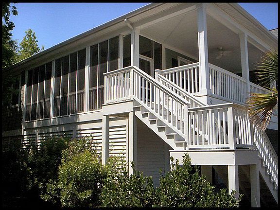 Stairs leading up to front open porch and screen porch