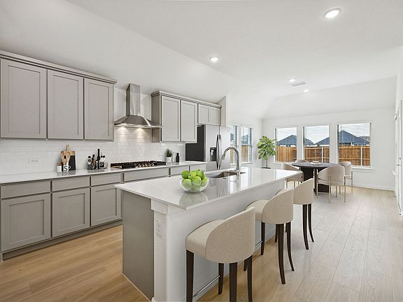 Kitchen in the Gilmour II home plan by Trophy Signature Homes - REPRESENTATIVE PHOTO