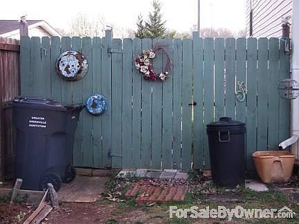Front left Privacy Fence with Gate
						:
						Greenville County garbage pick up & recycle on Mondays.