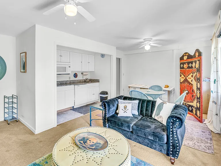 lower level family room with kitchenette, full fridge and microwave.