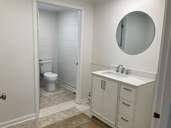 Full bath with separate dressing vanity area.