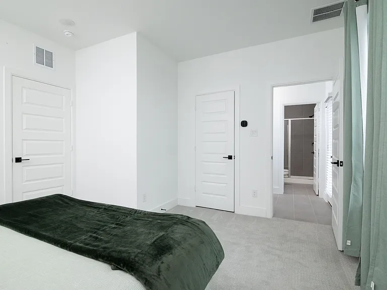Bedroom #2 has a queen bed with extra pillows and blankets available