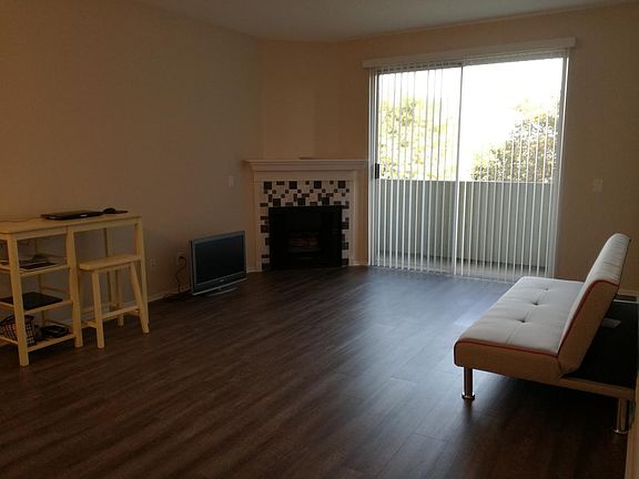 living room with gas fireplace and killer balcony view