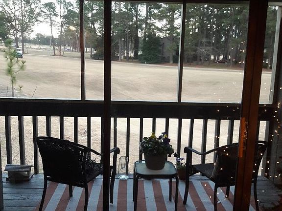 View of golf course from screened in porch