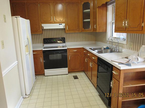 Kitchen with a side by side refrigerator/freezer, dish washer, range and powerful exhaust fan vented through the roof via smooth regid duct for efficient ventilation. It also has a special faucet dedicated for dispensing purified water for drinking, cooki