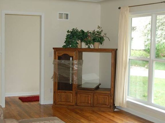 Living room with large window for plenty of natural light.