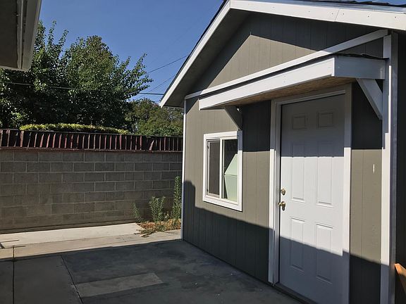 new built 400 square feet  shed in the backyard with laminat